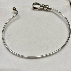 Tiffany & Co vintage bangle. Sterling silver with 18k gold ball closure.